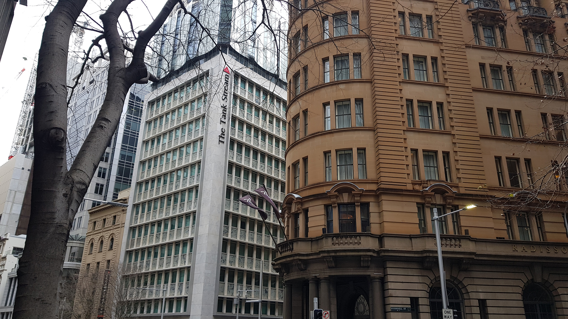 Commercial office buildings and heritage architecture in Melbourne CBD streetscape.