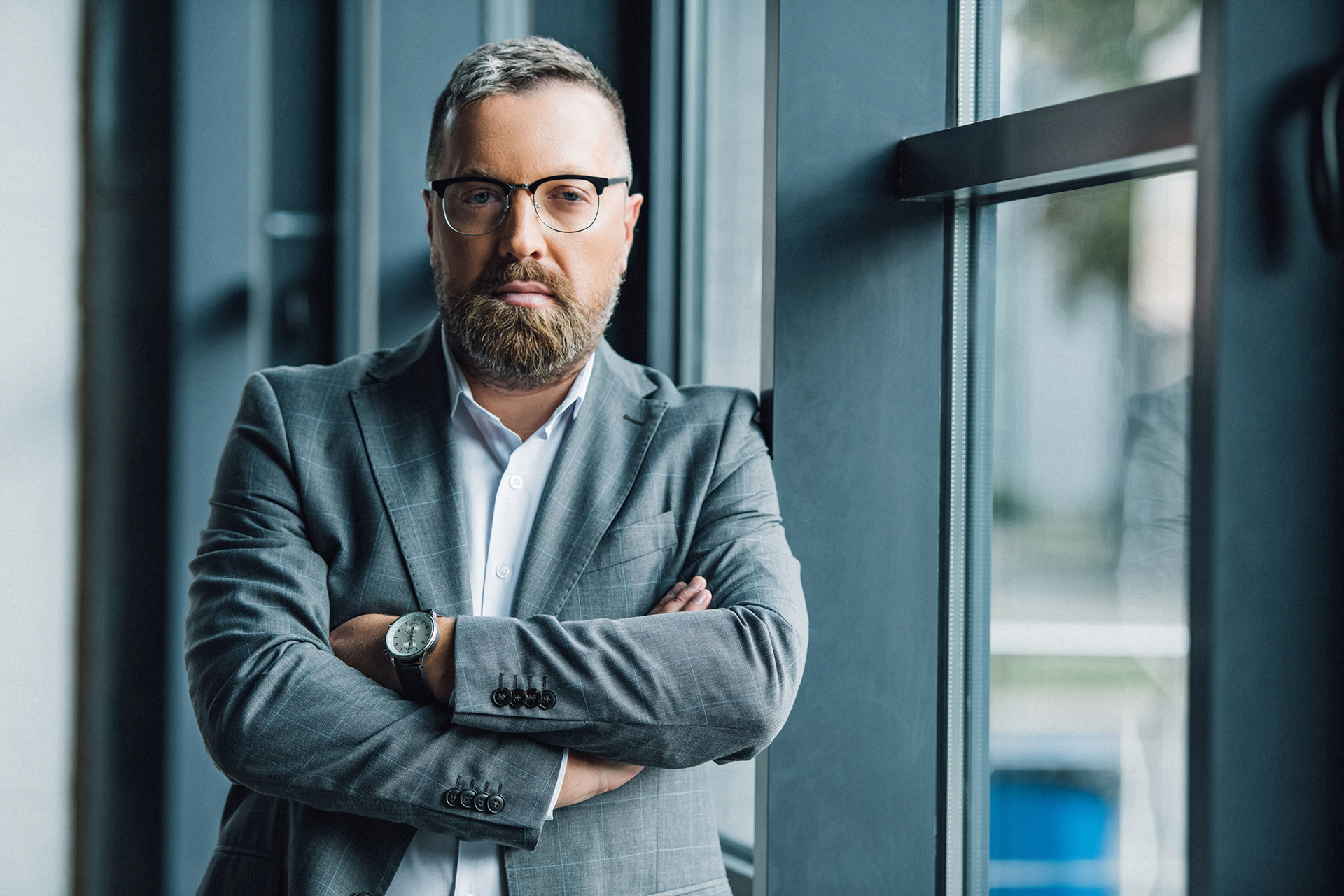 Commercial asset manager in a modern office environment overseeing property portfolio performance.