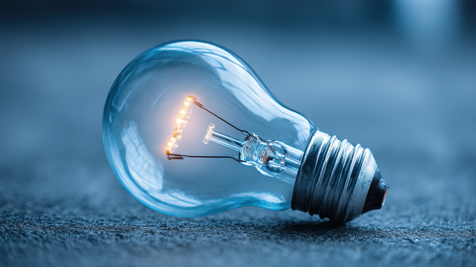 Illuminated light bulb representing governance, asset performance, building intelligence, and informed decision-making.