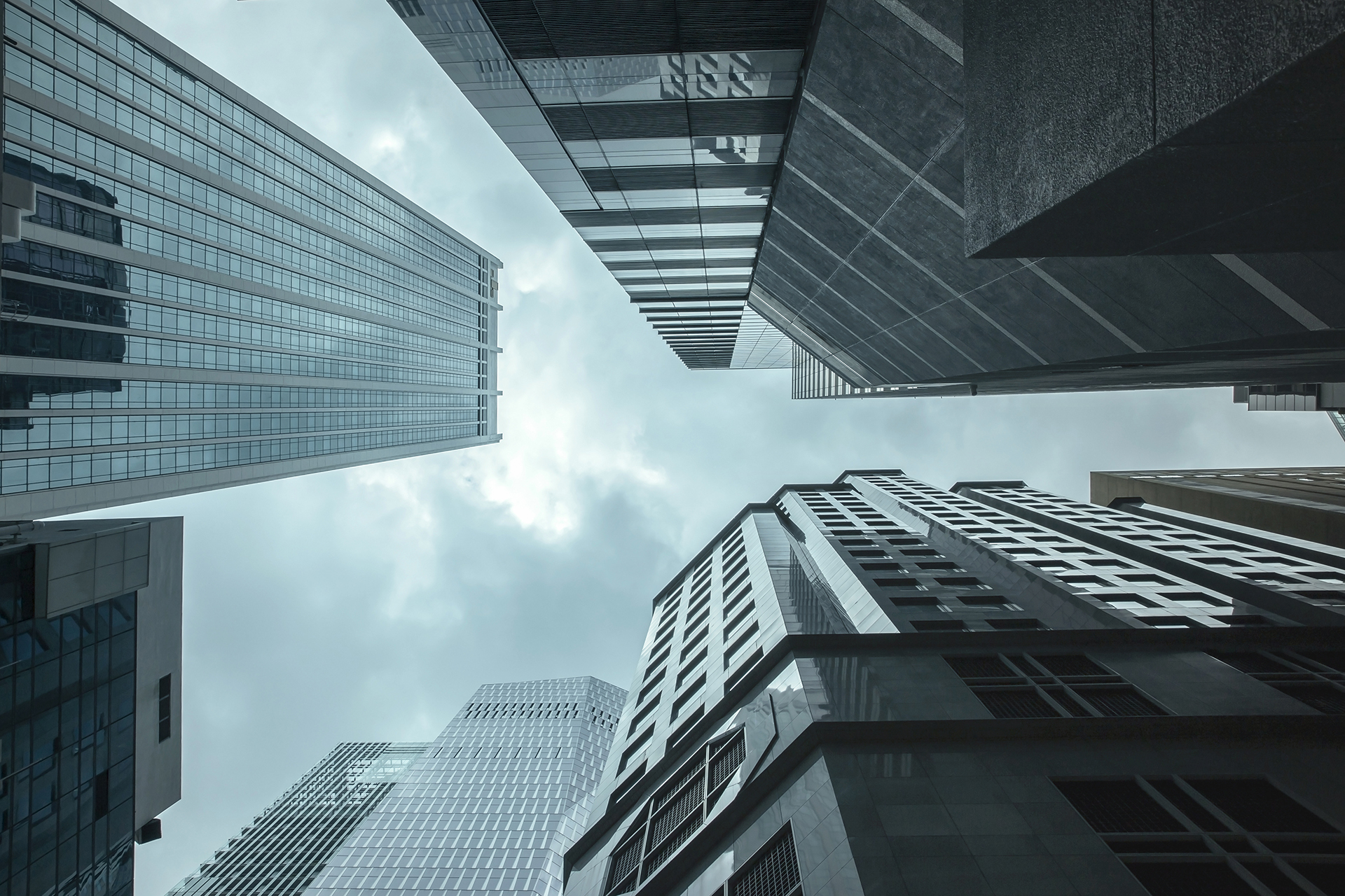 Modern commercial buildings representing governance across the building lifecycle from planning through operation and renewal.