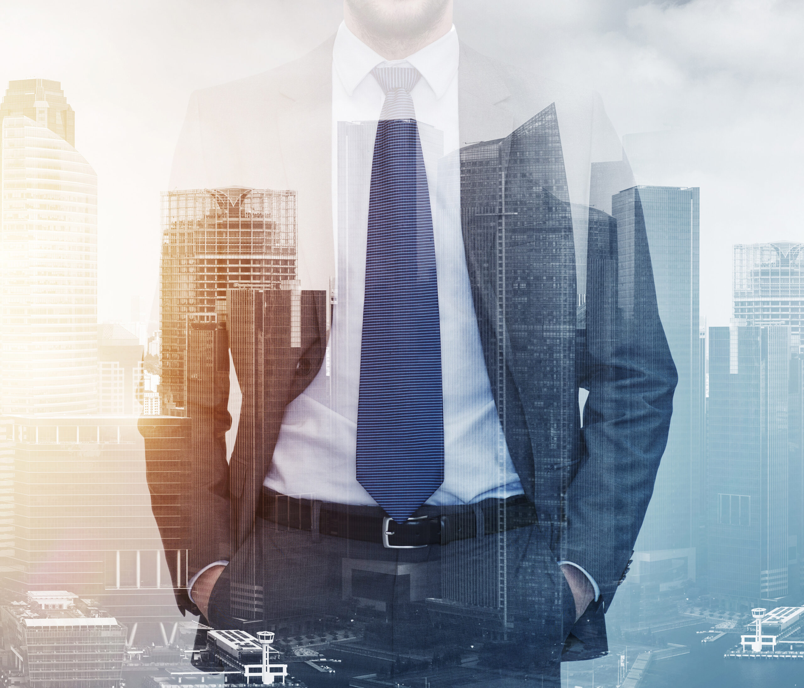 Business executive overlaid with a commercial city skyline representing property and asset management leadership.
