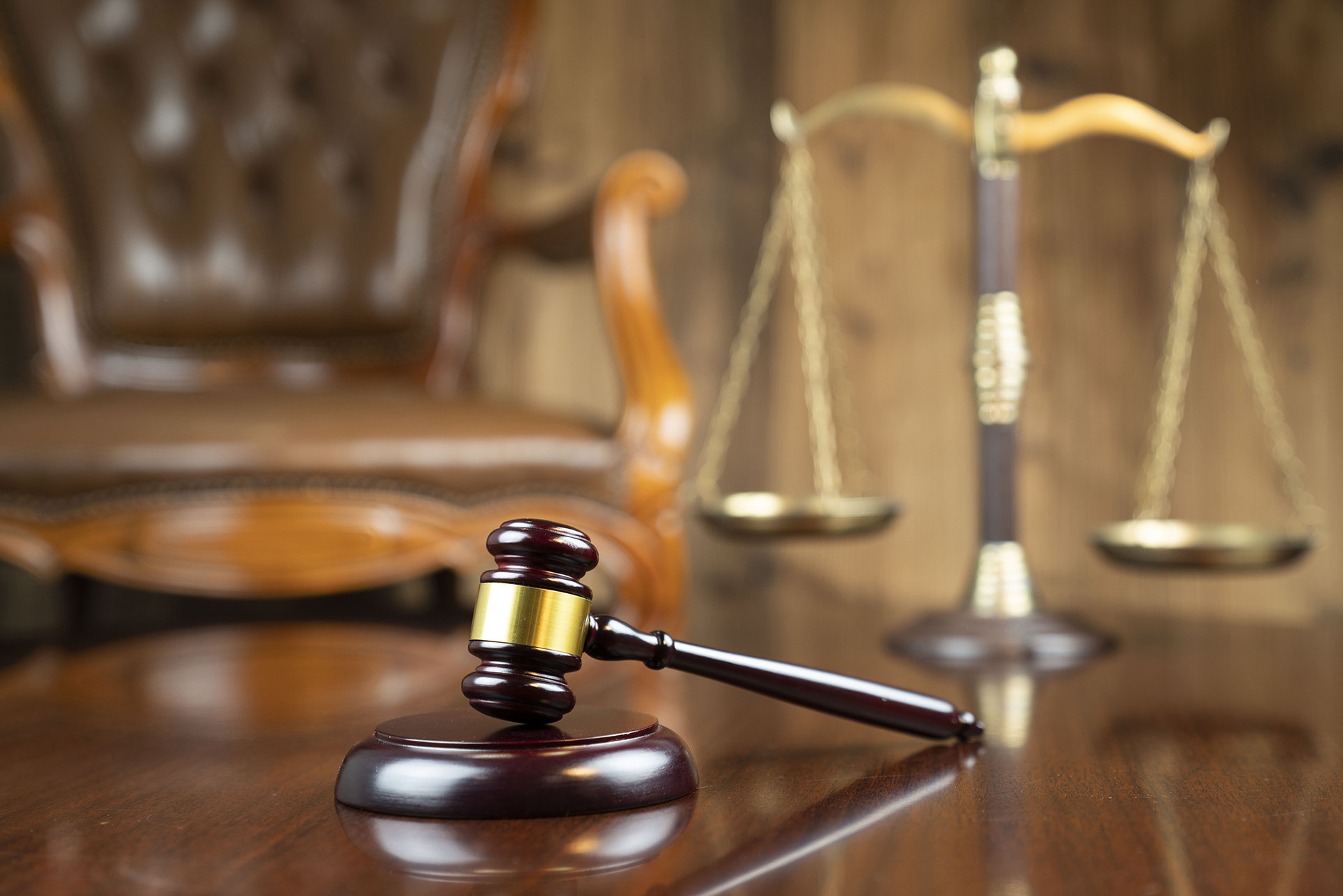 Judge’s gavel and scales of justice representing compliance governance, legal obligations, and risk management in commercial buildings.