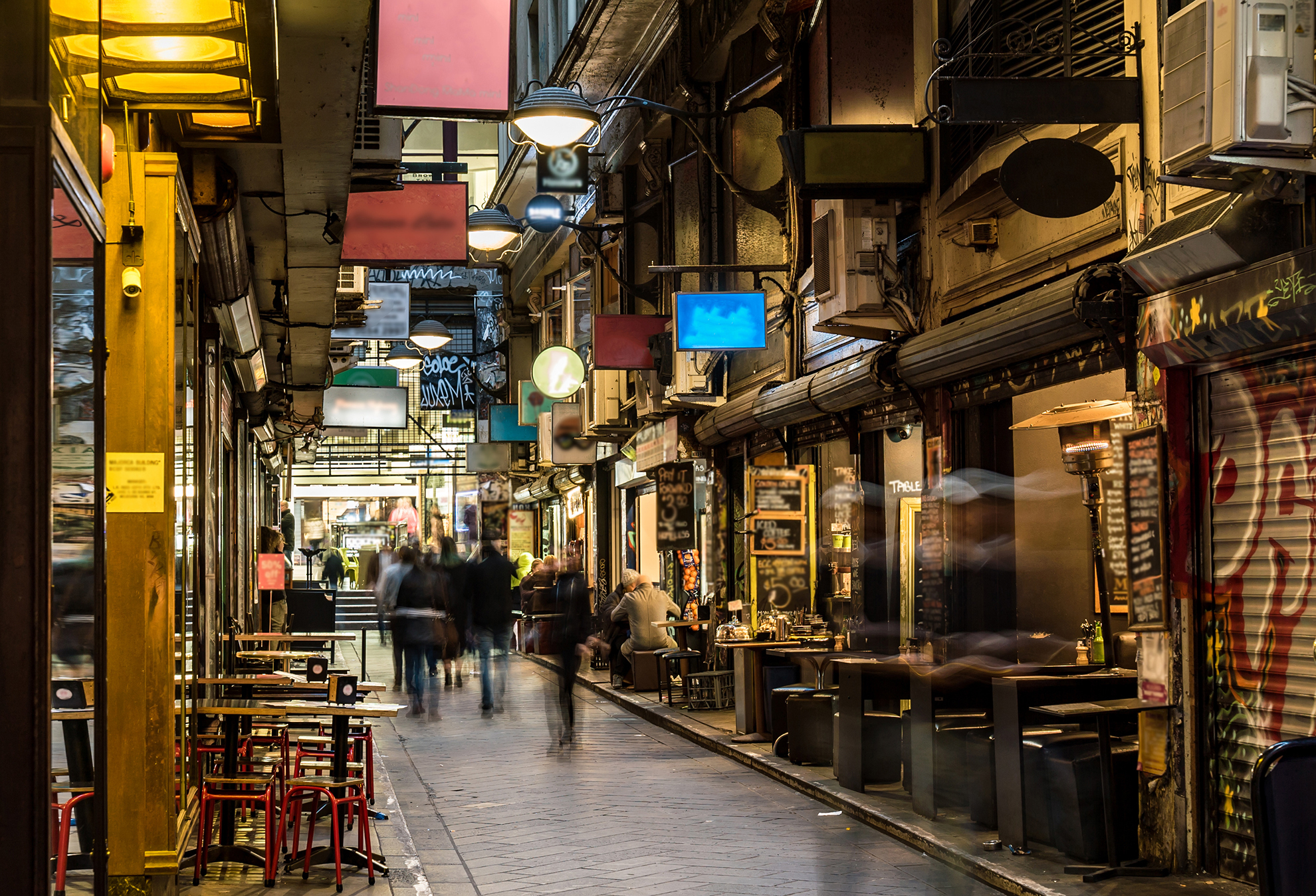 Melbourne laneway featuring cafés, restaurants, and retail businesses in a busy hospitality precinct.